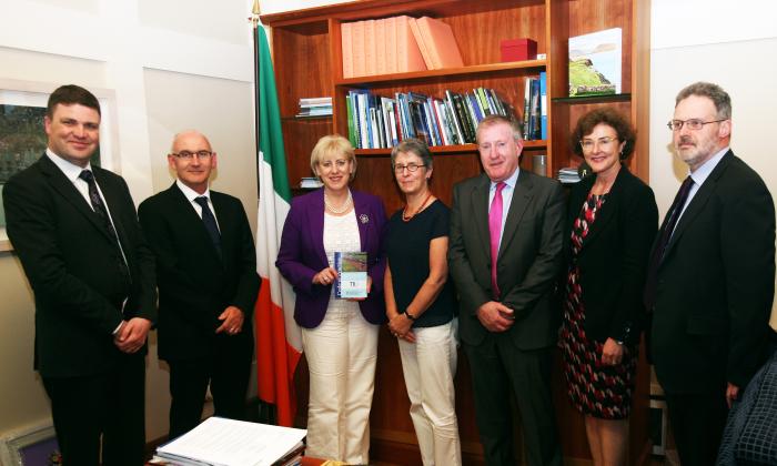Photo of the launch of the new TII Code of Practice for Archaeology showing (left to right) Rónán Swan, TII Head of Archaeology and Heritage, Michael Nolan, TII CEO, Heather Humphreys TD, Minister for Arts, Heritage, Regional, Rural and Gaeltacht Affairs, Dr Ann Lynch, Chief Archaeologist, National Monuments Service, Terry Allen, Principal Officer, National Monuments Service, Helen Hughes, TII Director of Professional Services, and Sean Kirwan, National Monuments Service (© National Monuments Service, Department of Arts, Heritage, Regional, Rural and Gaeltacht Affairs).