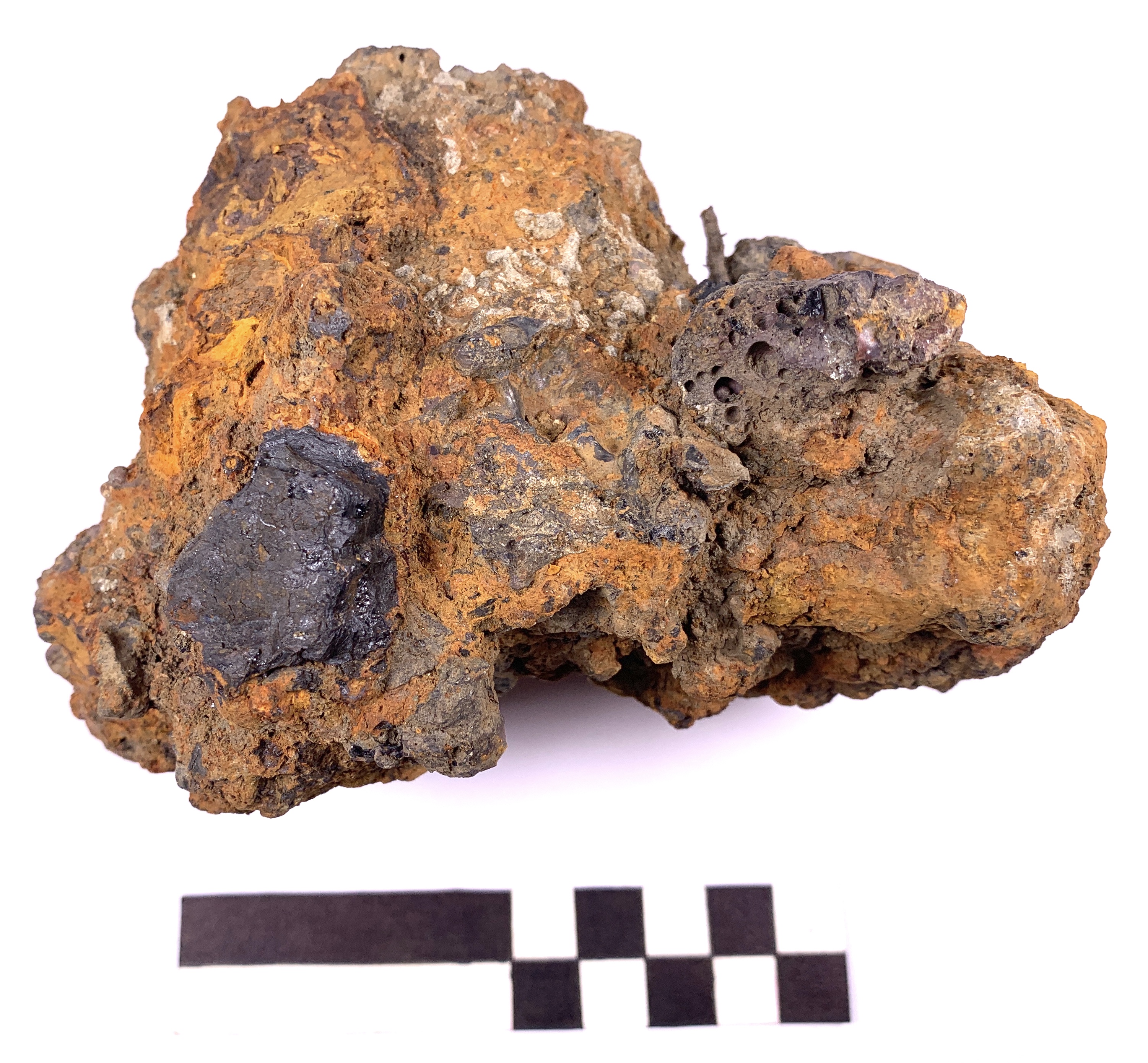 Illus. 10: Smithing hearth cake with large inclusion of anthracite coal evident (Photo: Paul Rondelez).
