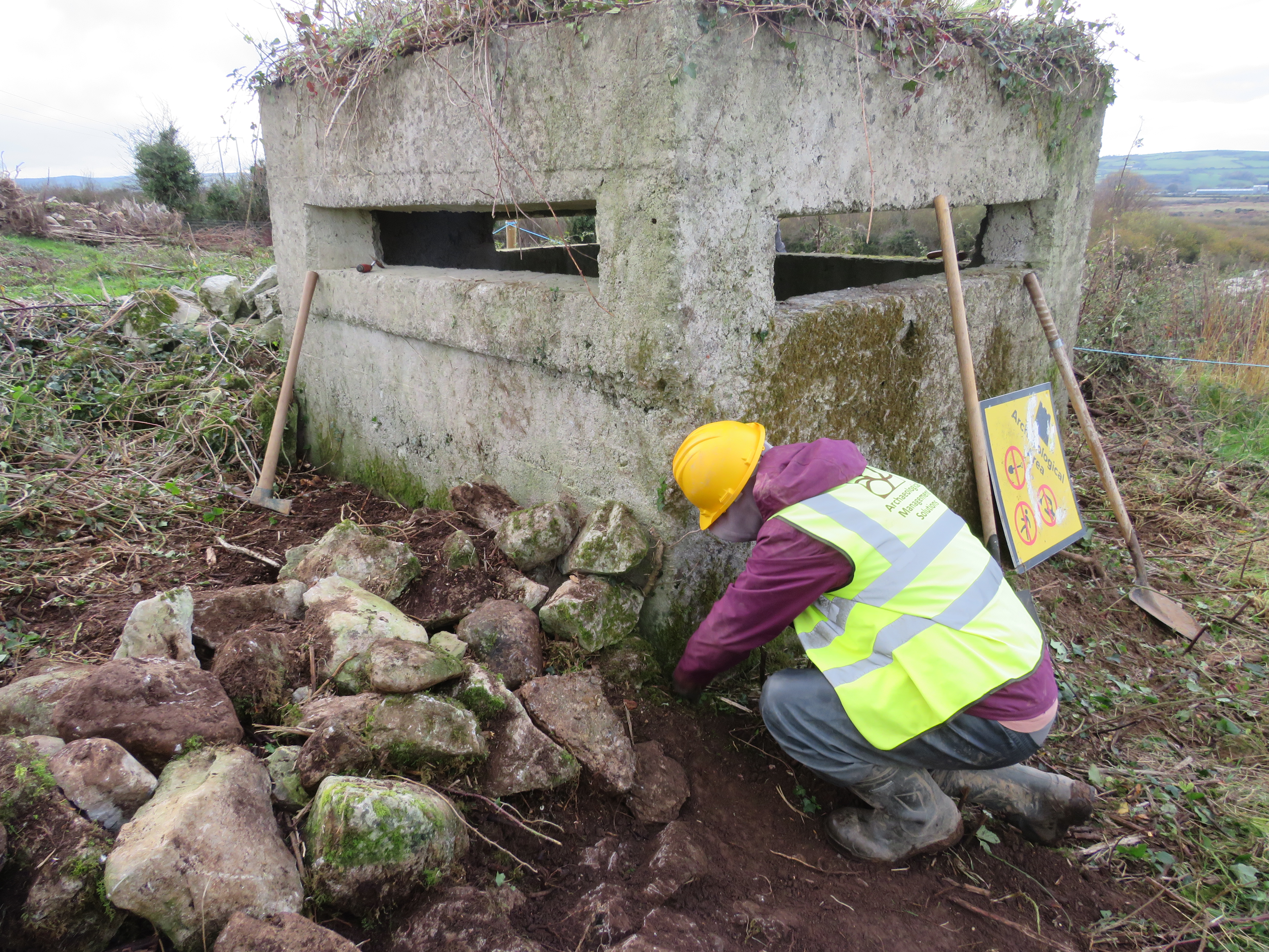 Illustration 11: Test excavation underway around the base of a pillbox (PB02) in Mulderricksfield/Craggs (Photo: AMS)