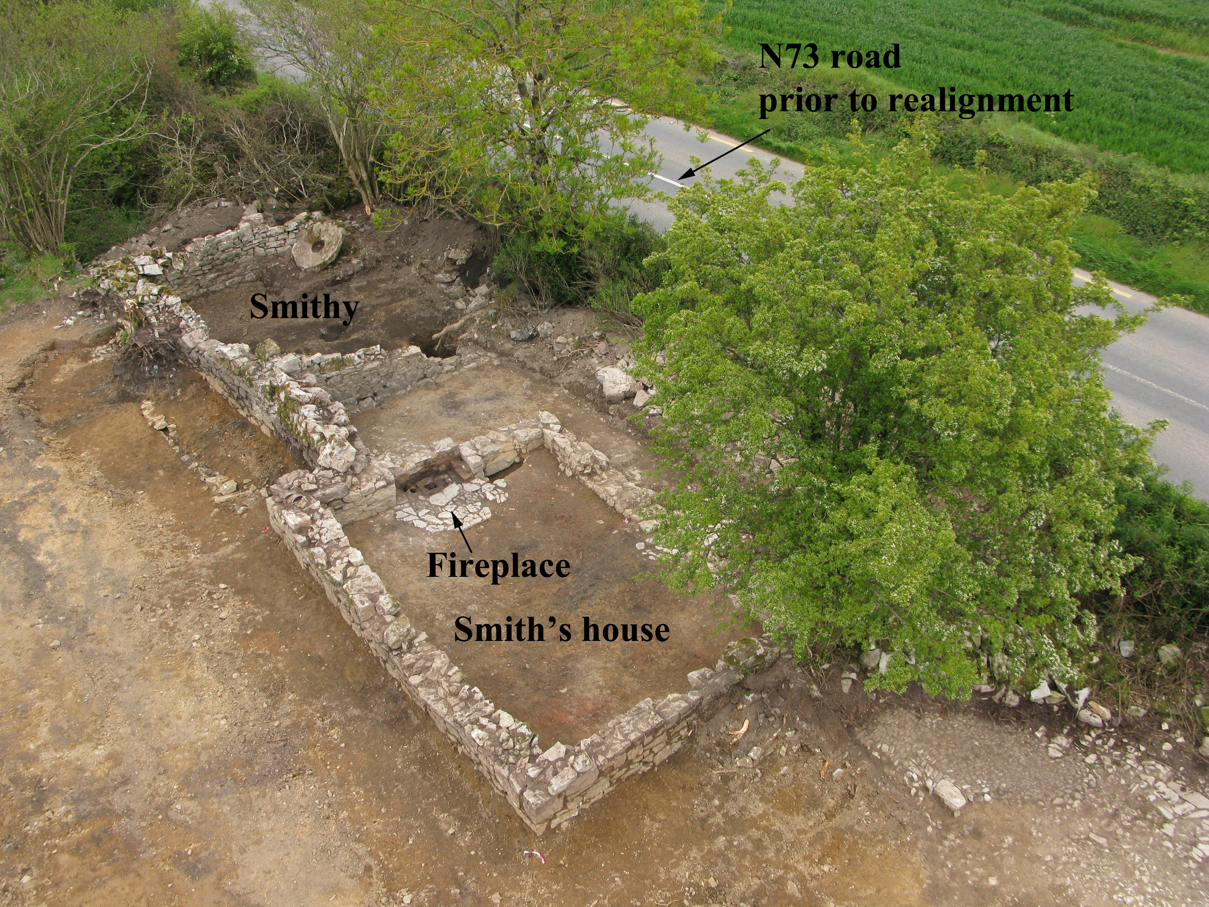 Illus. 4: Aerial view of excavated smithy at Clenor South with domestic dwelling in foreground. South-east to top (Photo: Airshots).