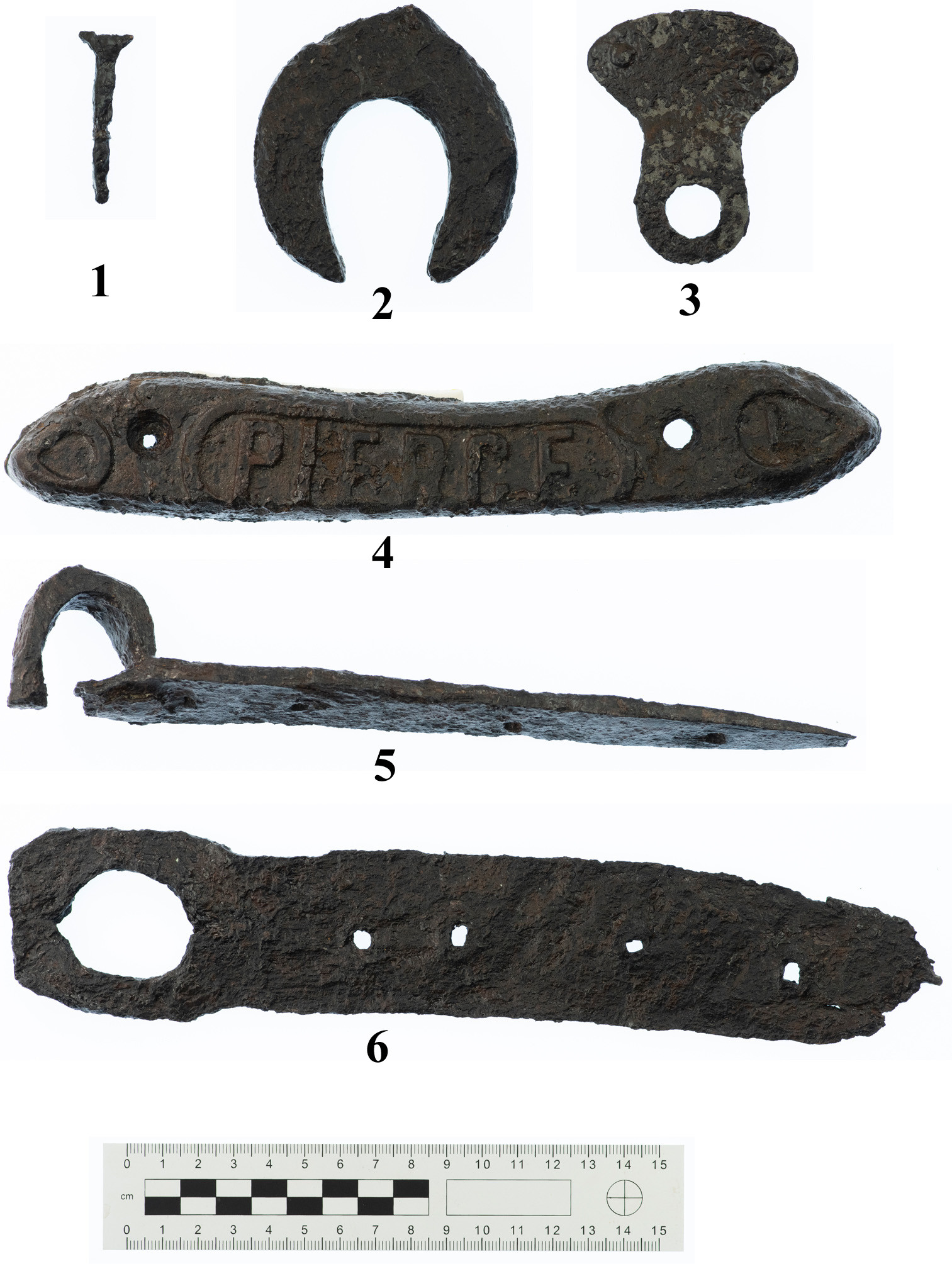 Illus. 8: Examples of iron objects from Clenor South. 1: Horseshoe nail. 2: Possible 17th-century style proto horseshoe or uncompleted trial piece. 3: Peltate (shield-shaped) object; probably a fitting for a handle on a vessel such as a cauldron. 4: Plaque bearing the name Pierce. The Pierce Foundry, founded in Wexford in 1839, manufactured horse-drawn farming vehicles, which were shipped worldwide. 5: Door hinge fragment. 6: Nail maker. The nails were driven through the various-sized holes in the flat plate, which, in this case, had a convenient loop allowing it to be hung on the wall of the forge when not in use (Photo: Dylan Duane Roche).